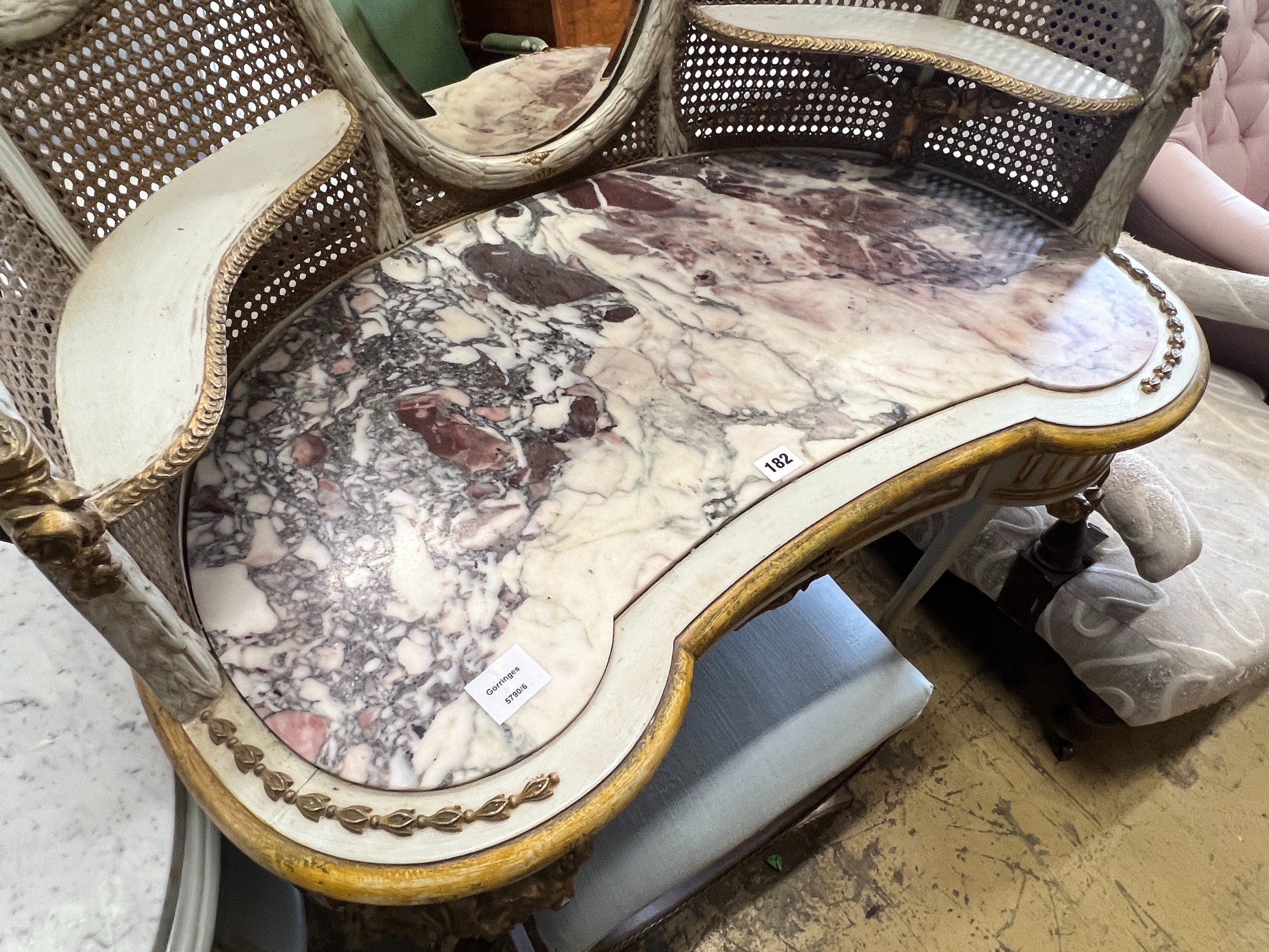 An early 20th century unusual French painted parcel gilt caned marble topped kidney shaped dressing table, width 91cm, depth 50cm, height 138cm and a stool